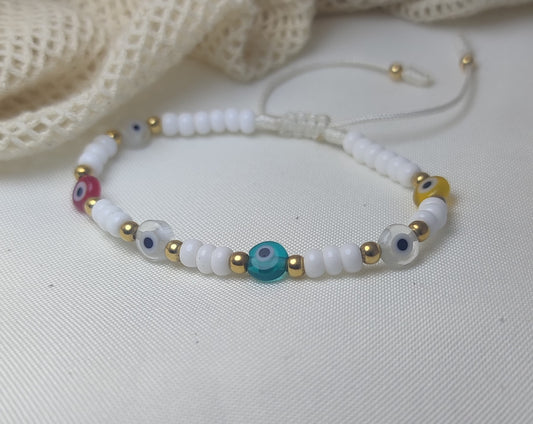 Pulsera ojo turco tejida con Oro de 18kl